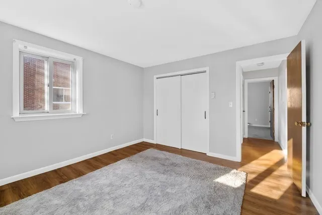 a view of a room that has a bed in it