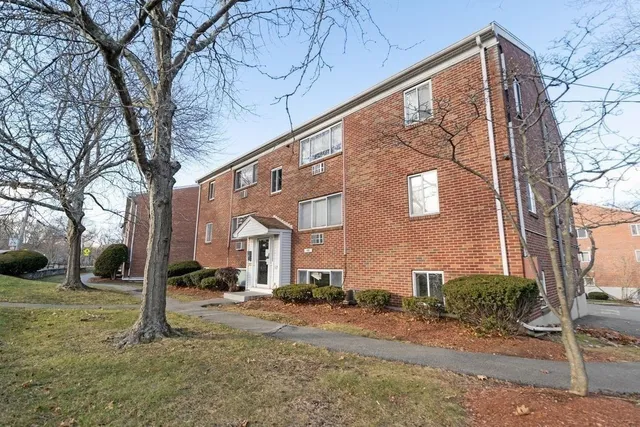 a view of a building with a yard