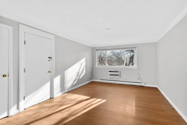 a view of an empty room with a window