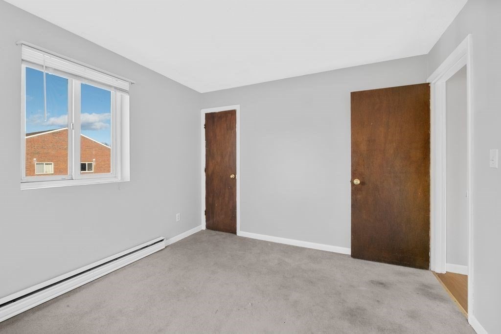 133 Winthrop Street, Unit 21 Framingham, MA 01702 - Photo 10 of 15 a view of an empty room with a window