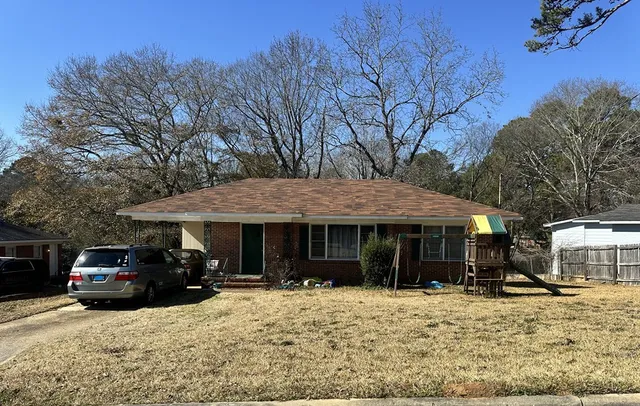 a house with trees in the background