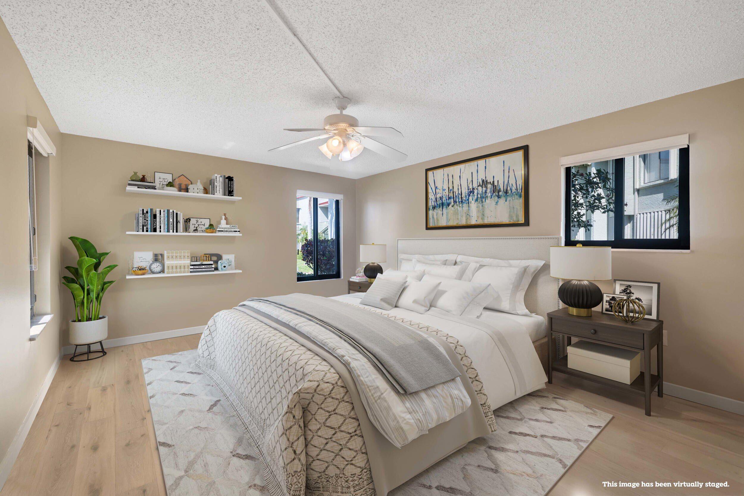 5443 Southeast Miles Grant Road, Unit D101 Stuart, FL 34997 - Photo 11 of 21 Master bedroom (virtually staged)