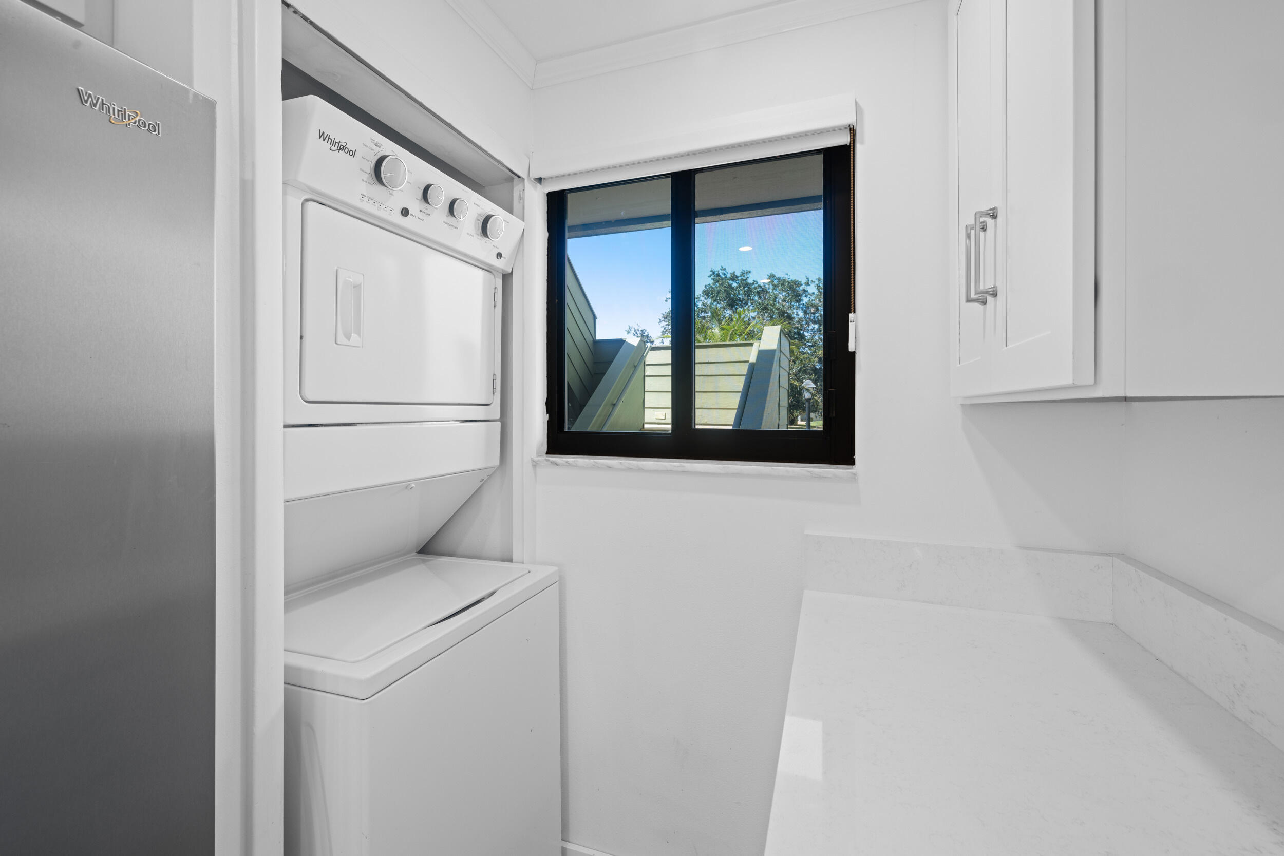 5443 Southeast Miles Grant Road, Unit D101 Stuart, FL 34997 - Photo 5 of 21 Washer/dryer detail