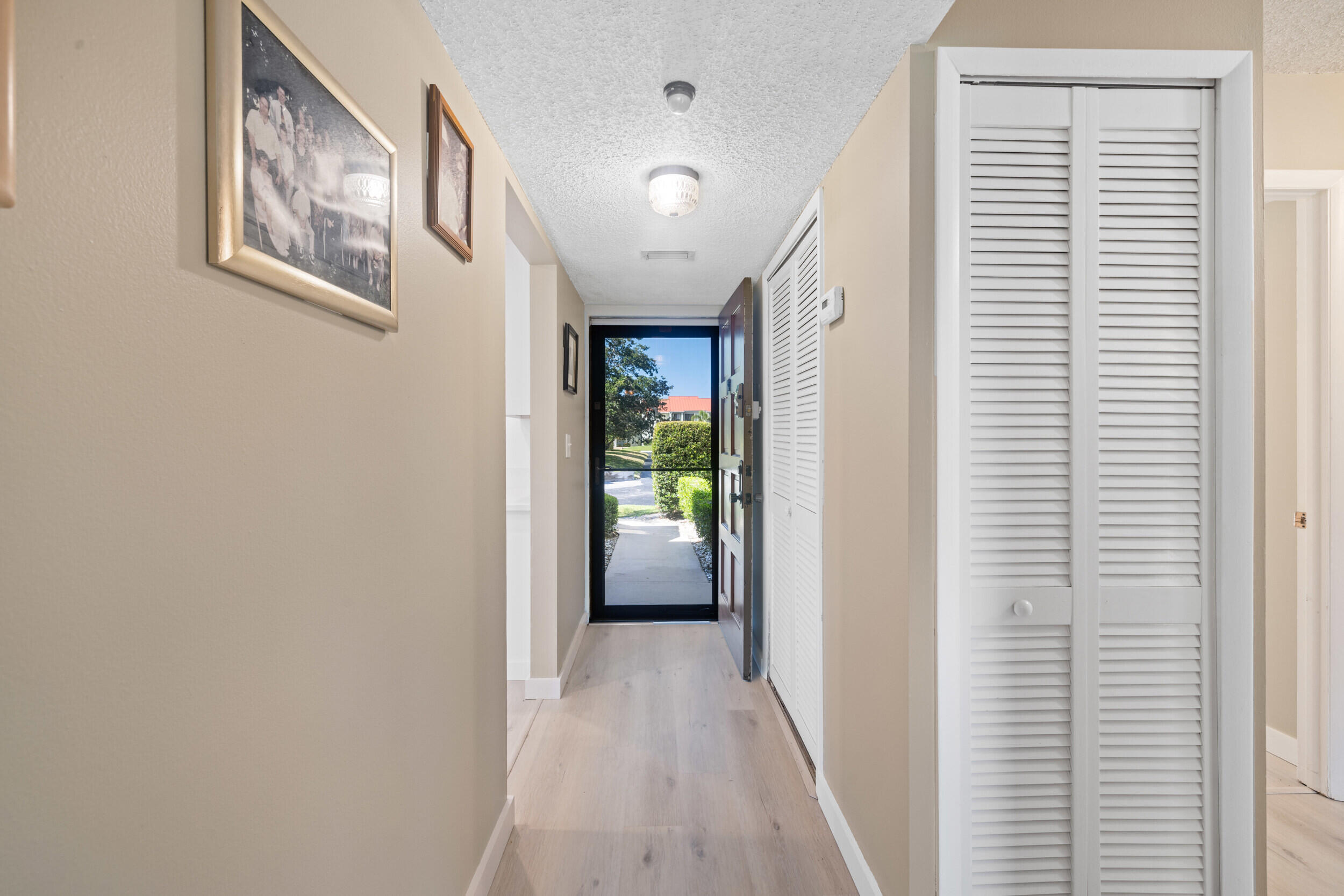 5443 Southeast Miles Grant Road, Unit D101 Stuart, FL 34997 - Photo 10 of 21 Hallway front entrance