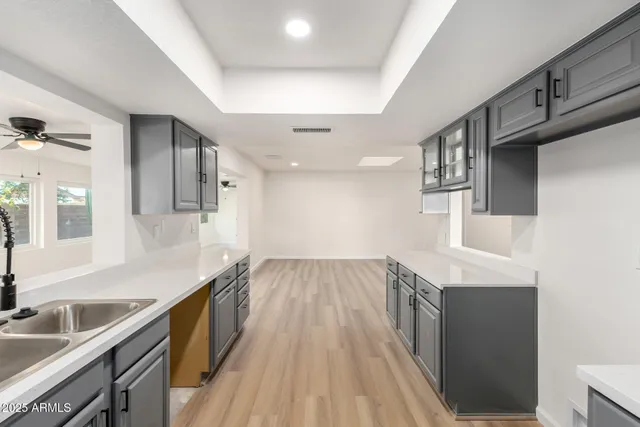 a view of a kitchen cabinets a sink and dishwasher in a kitchen
