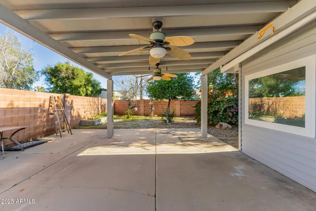 a view of yard with patio