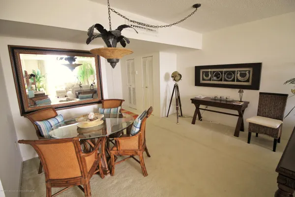 a living room with a bed furniture and a wooden floor