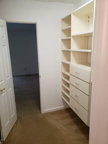 a view of an empty walk in closet