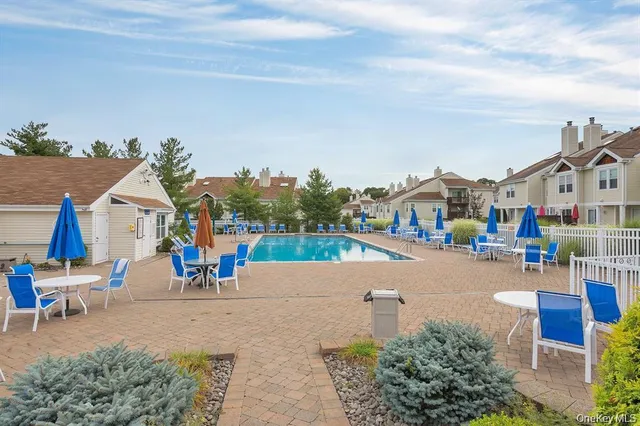 an aerial view of a house with outdoor space patio and sitting area