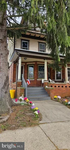 front view of a house with a small yard