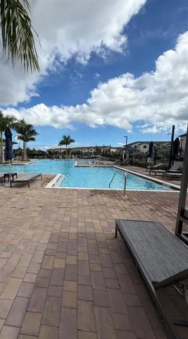 a view of a wooden deck with a lake