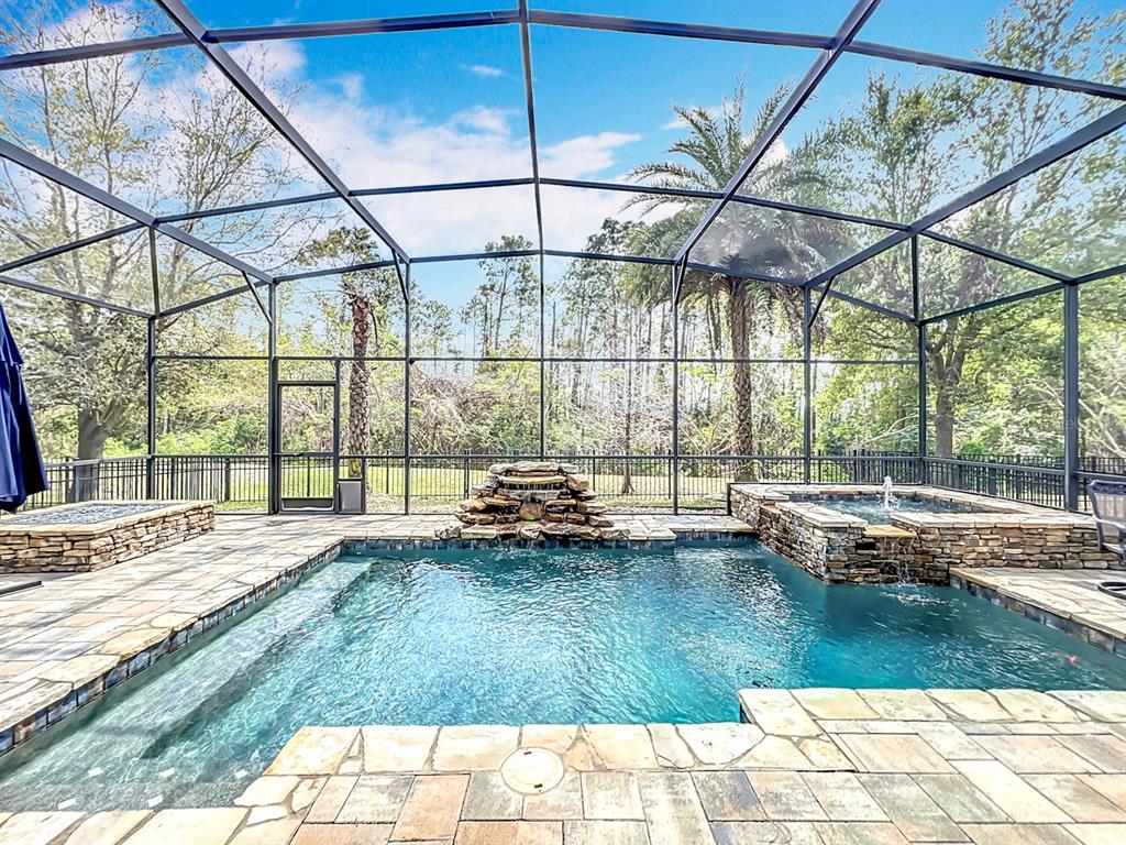 1813 Vista Meadows Drive Ocoee, FL 34761 - Photo 1 of 1 a swimming pool with outdoor seating and yard