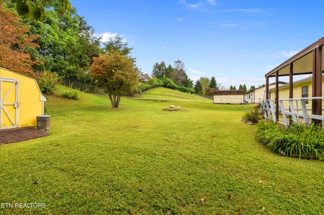 a view of a pathway both side of the house