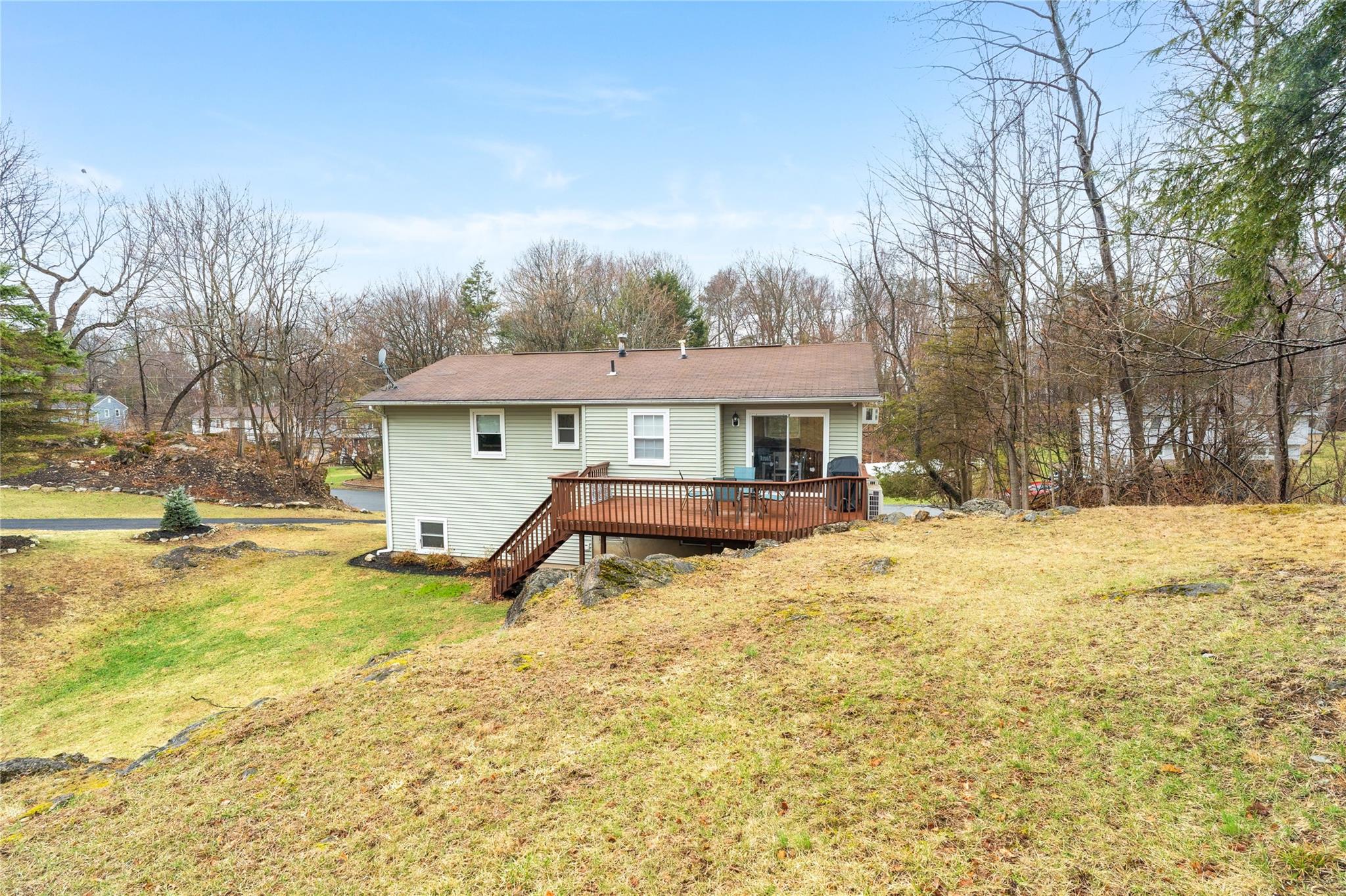 45 Raker Road Poughkeepsie, NY 12603 - Photo 22 of 25 Rear view of house with roof with shingles, a deck, and a yard