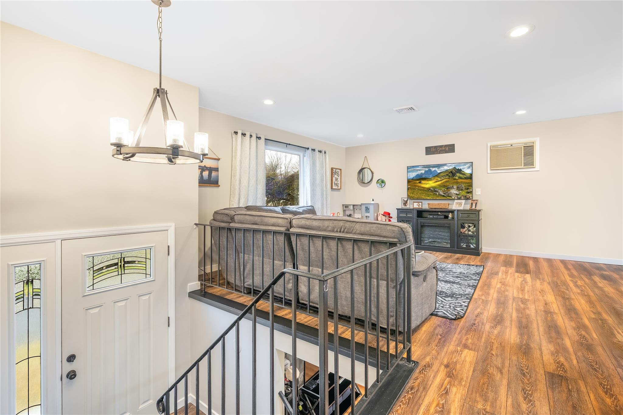 45 Raker Road Poughkeepsie, NY 12603 - Photo 3 of 25 Living area with recessed lighting, baseboards, a chandelier, visible vents, and wood finished floors