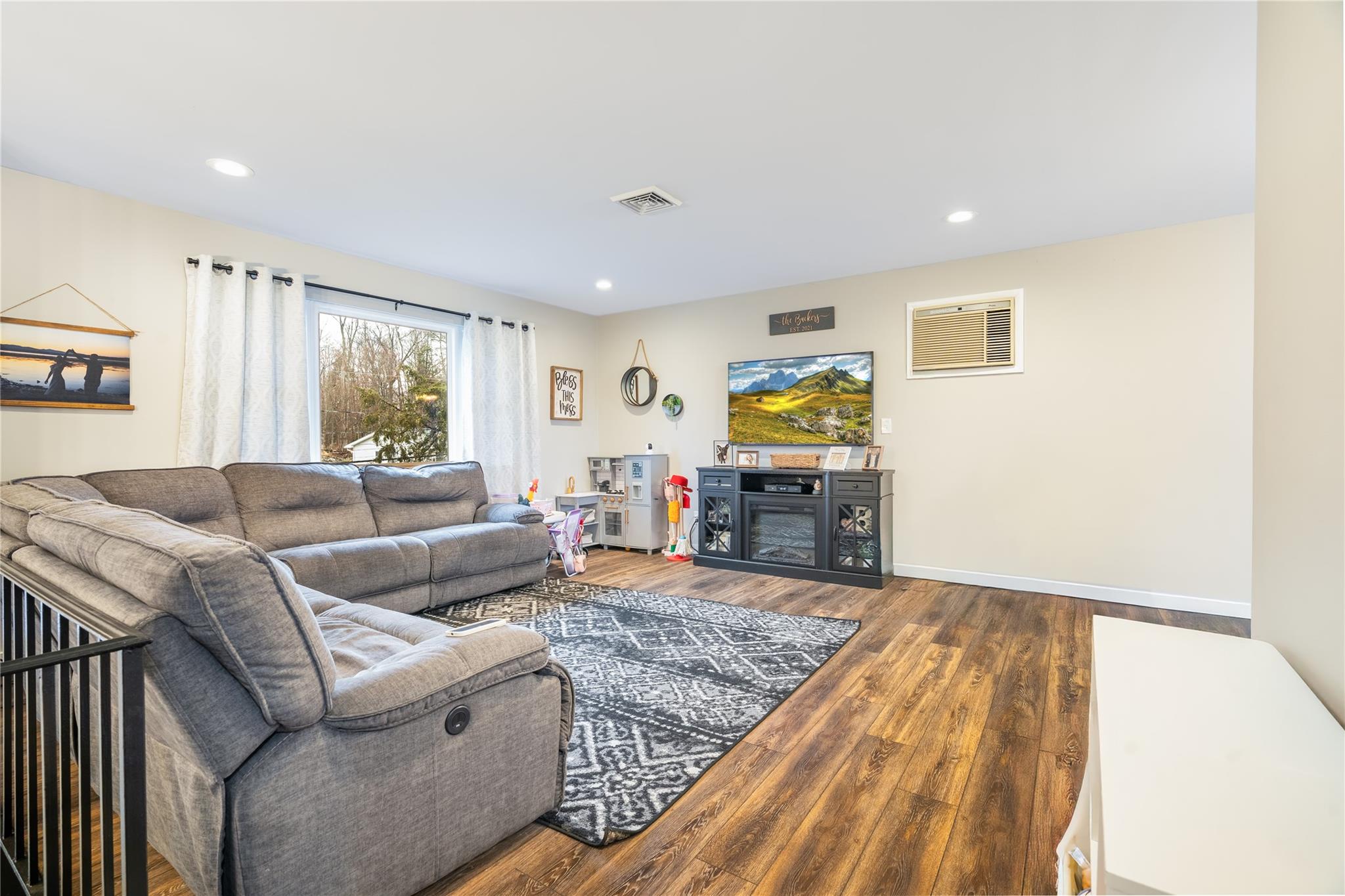 45 Raker Road Poughkeepsie, NY 12603 - Photo 4 of 25 Living room with visible vents, recessed lighting, and wood finished floors