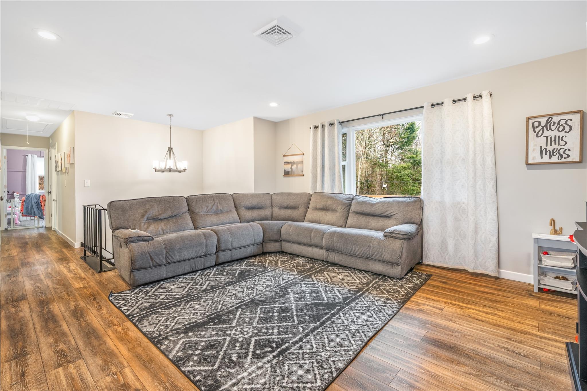 45 Raker Road Poughkeepsie, NY 12603 - Photo 5 of 25 Living area featuring attic access, recessed lighting, baseboards, visible vents, and wood finished floors
