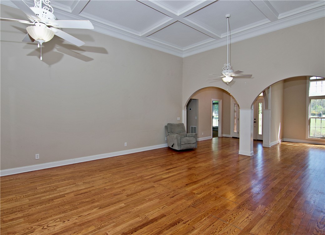 7893 Athens Road Carnesville, GA 30521 - Photo 16 of 50 This expansive living space features rich hardwood floors and elegant arched doorways.