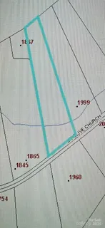 a view of a yard with trees