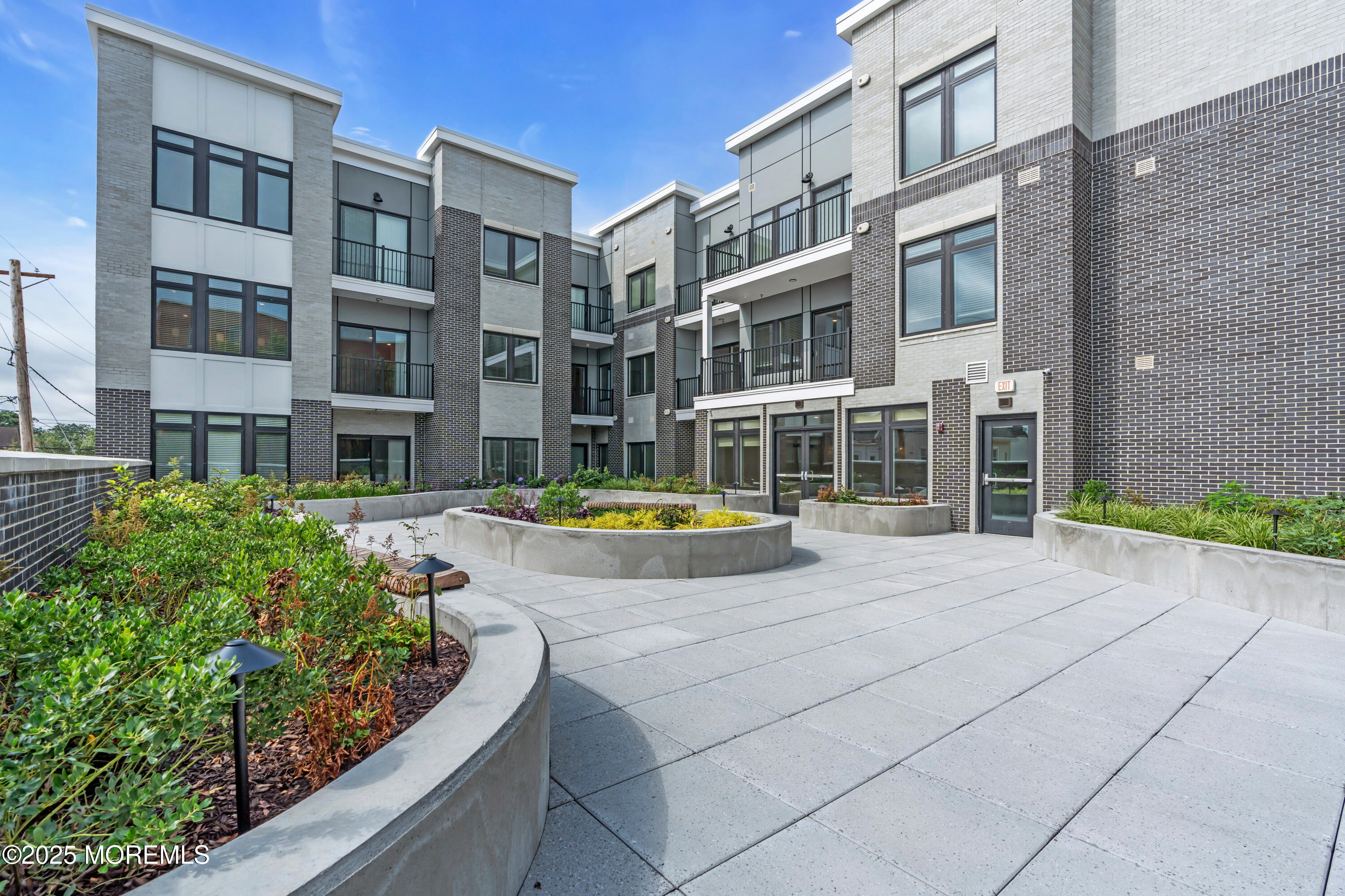 120 Monmouth Street, Unit 302 Red Bank, NJ 07701 - Photo 25 of 37 a view of an buildings with swimming pool