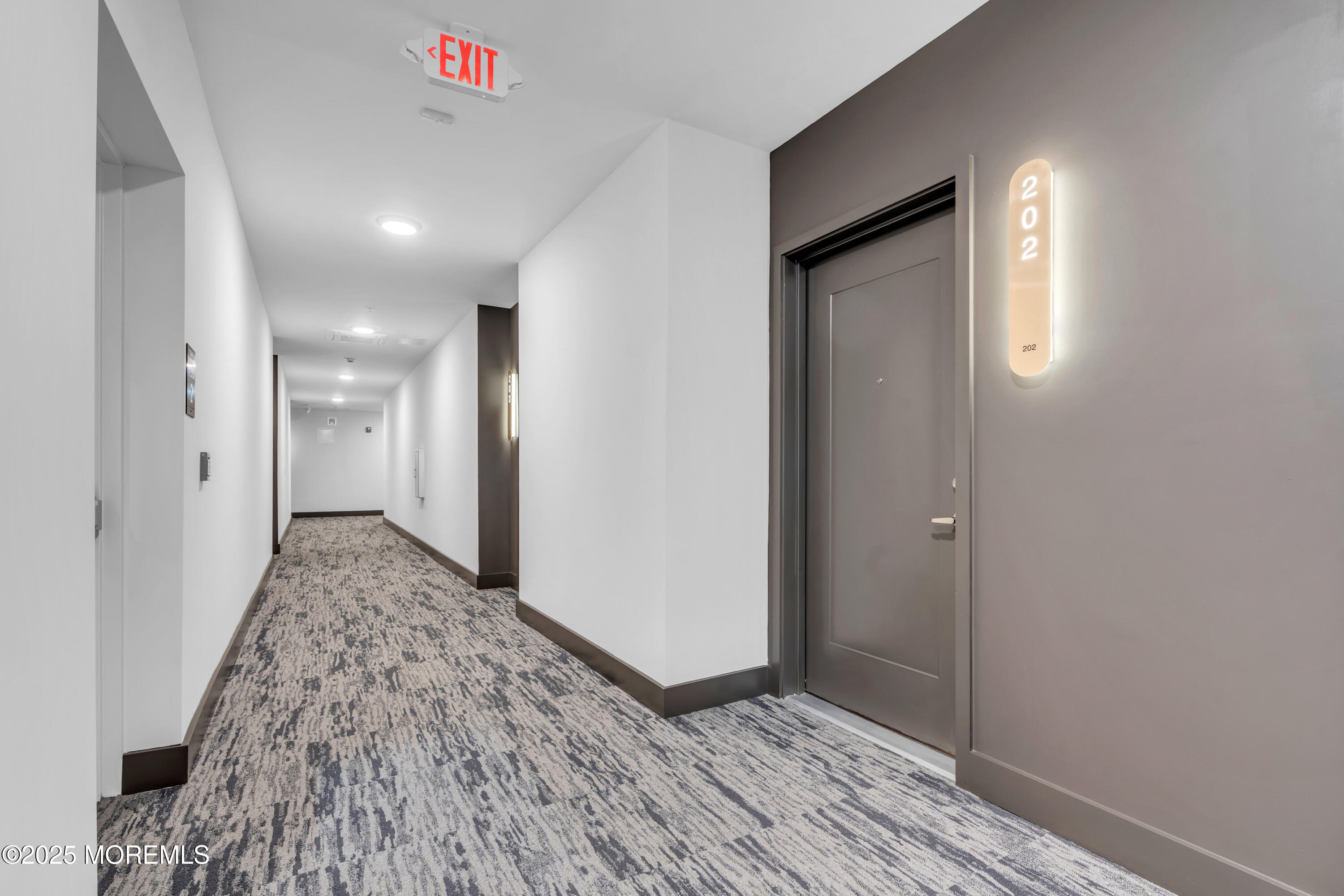 120 Monmouth Street, Unit 302 Red Bank, NJ 07701 - Photo 30 of 37 a view of hallway with wooden floor