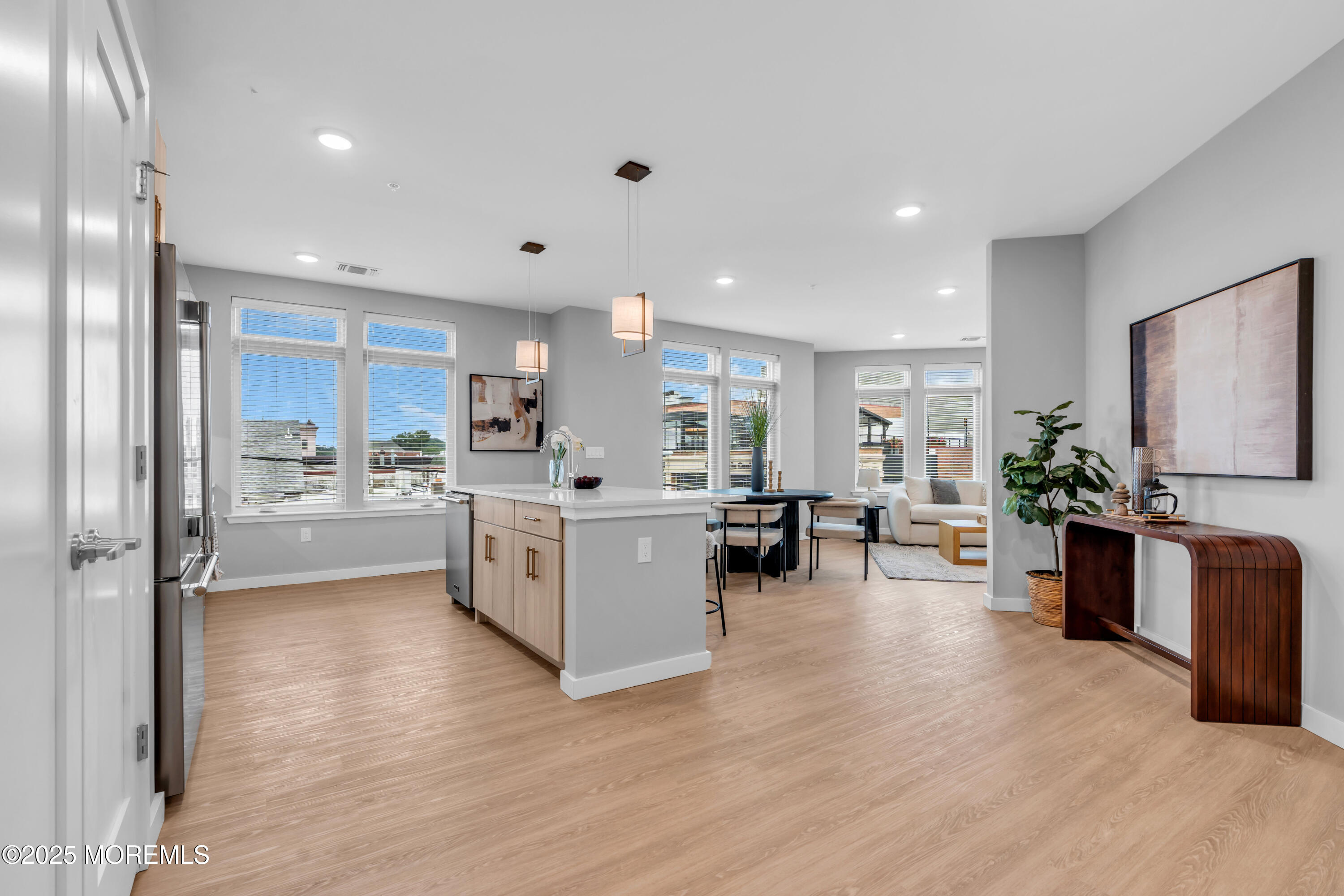 120 Monmouth Street, Unit 302 Red Bank, NJ 07701 - Photo 3 of 37 a kitchen with furniture and a large window