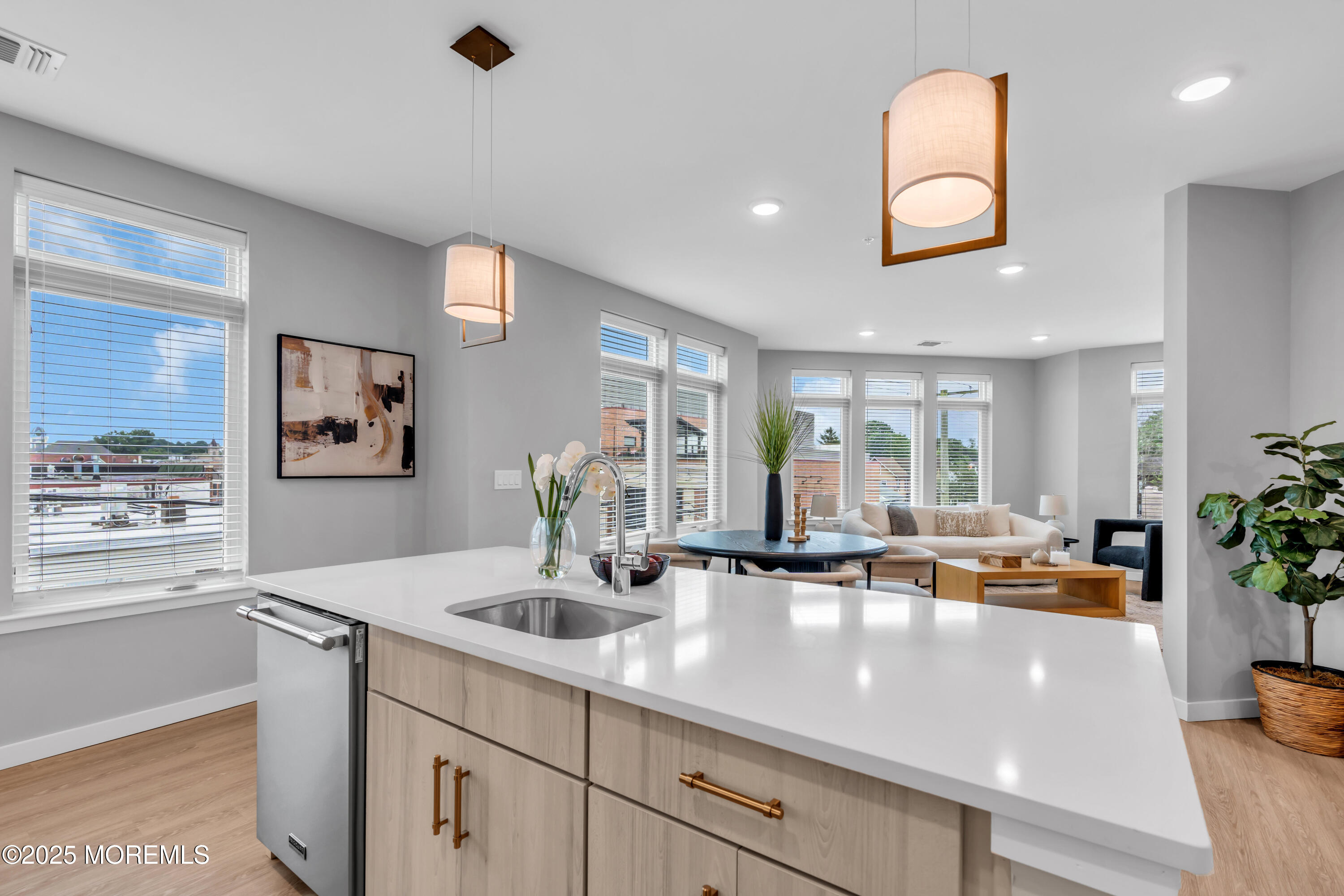 120 Monmouth Street, Unit 302 Red Bank, NJ 07701 - Photo 7 of 37 a view of living room with stainless steel appliances granite countertop a sink and a large window