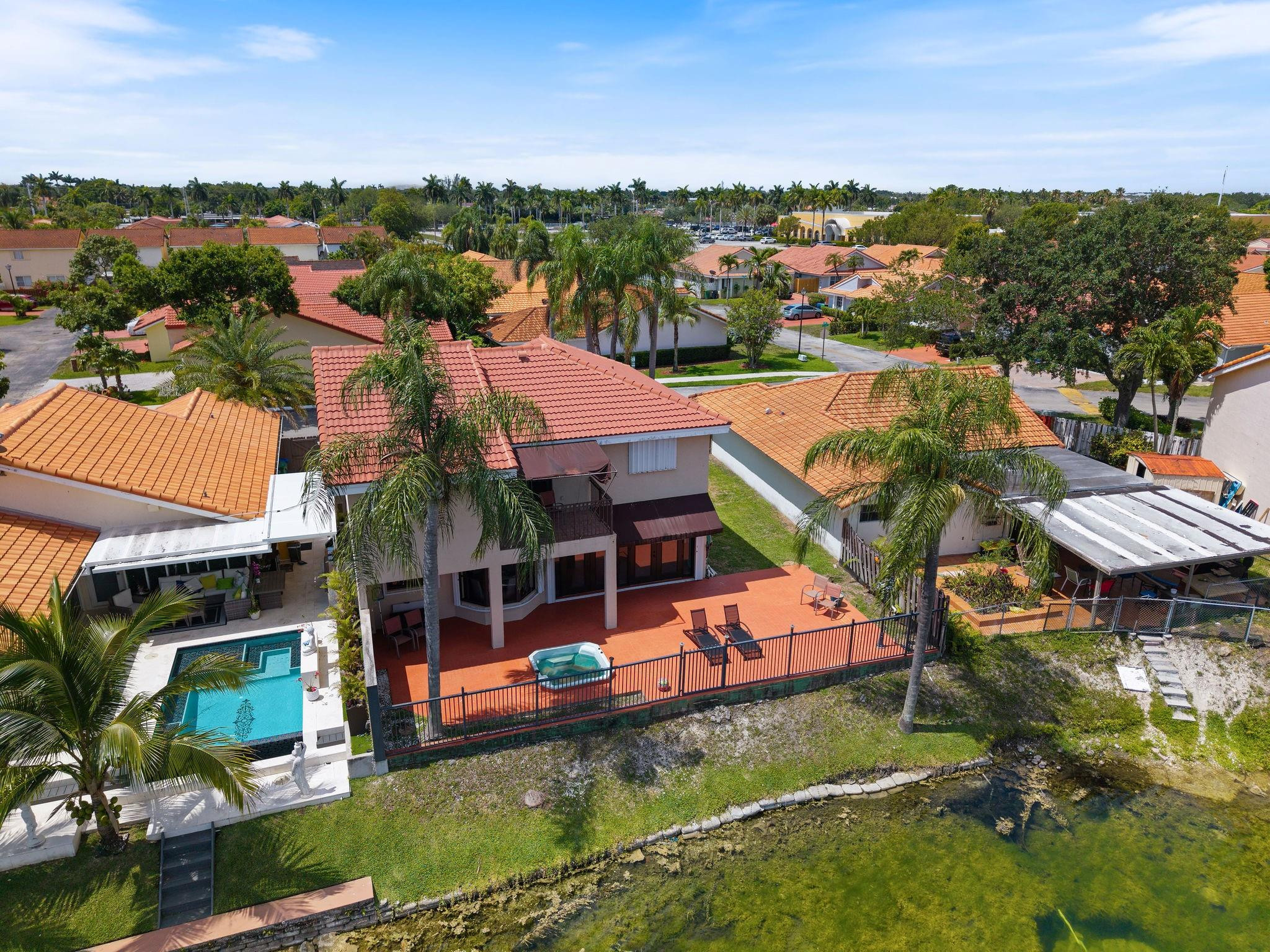 8313 Northwest 188th Terrace Hialeah, FL 33015 - Photo 11 of 50 an aerial view of a house with a garden