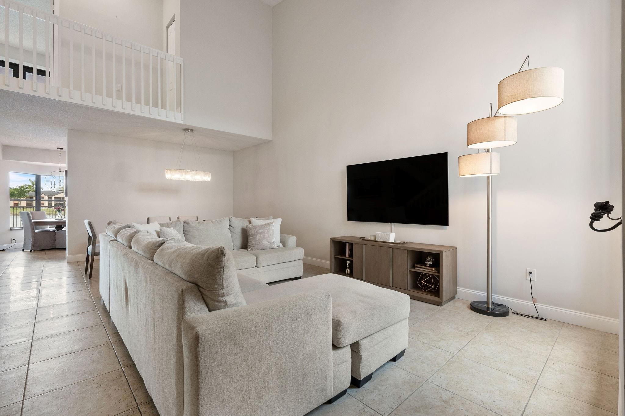 8313 Northwest 188th Terrace Hialeah, FL 33015 - Photo 17 of 50 a living room with furniture and a flat screen tv