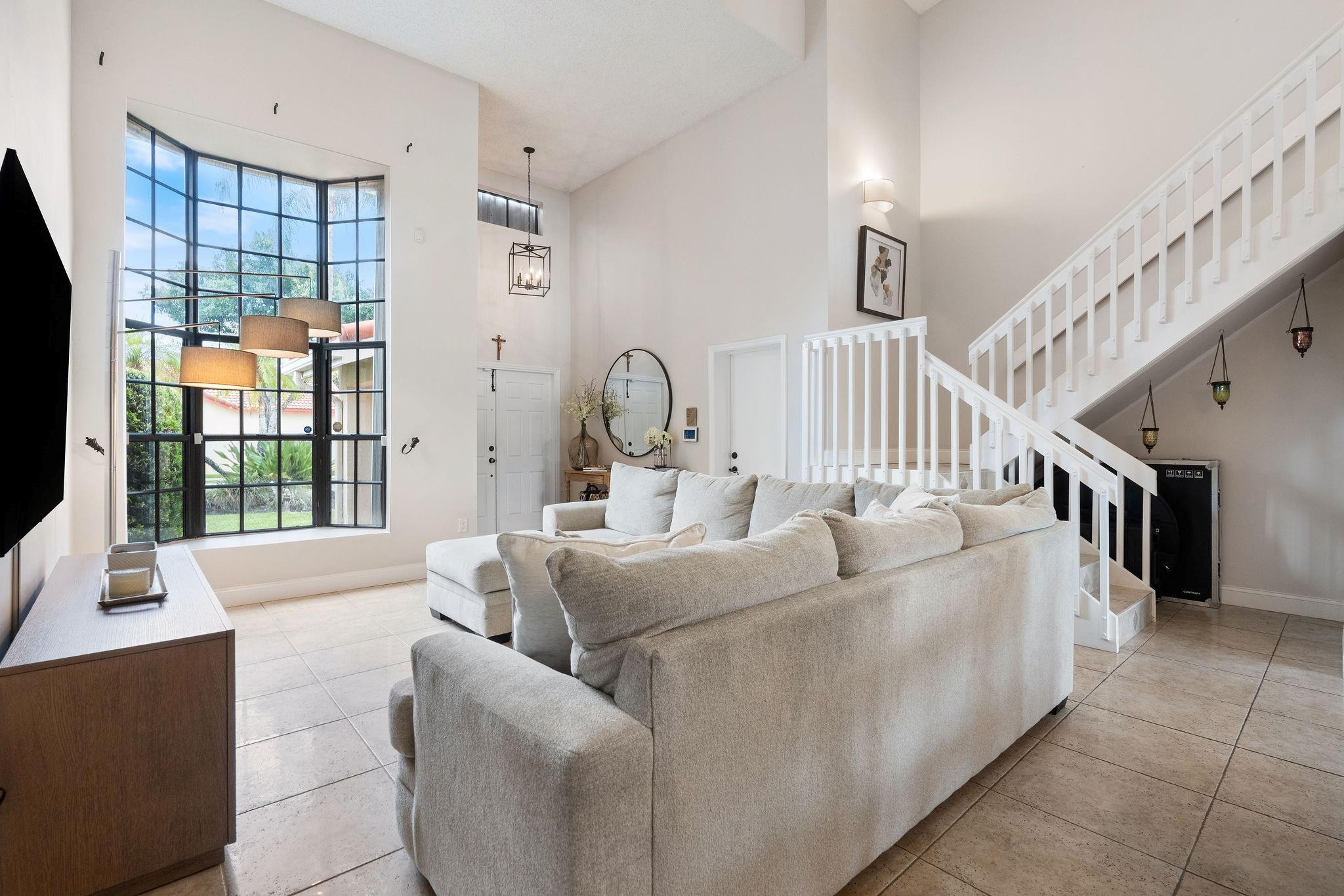 8313 Northwest 188th Terrace Hialeah, FL 33015 - Photo 18 of 50 a living room with furniture and a large window