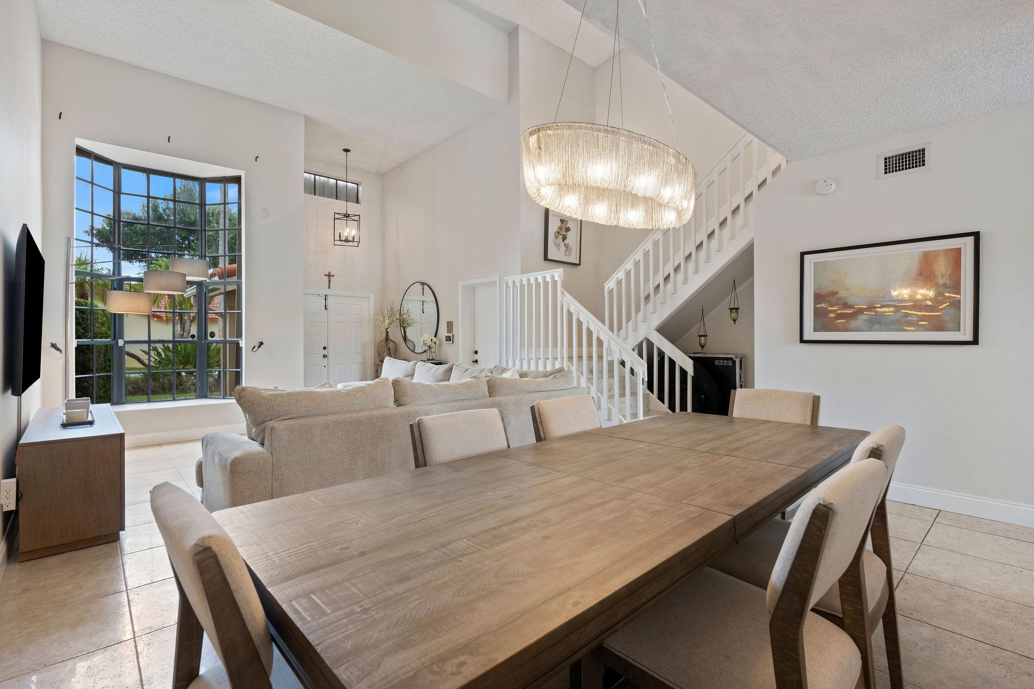 8313 Northwest 188th Terrace Hialeah, FL 33015 - Photo 21 of 50 a living room with large table and chairs