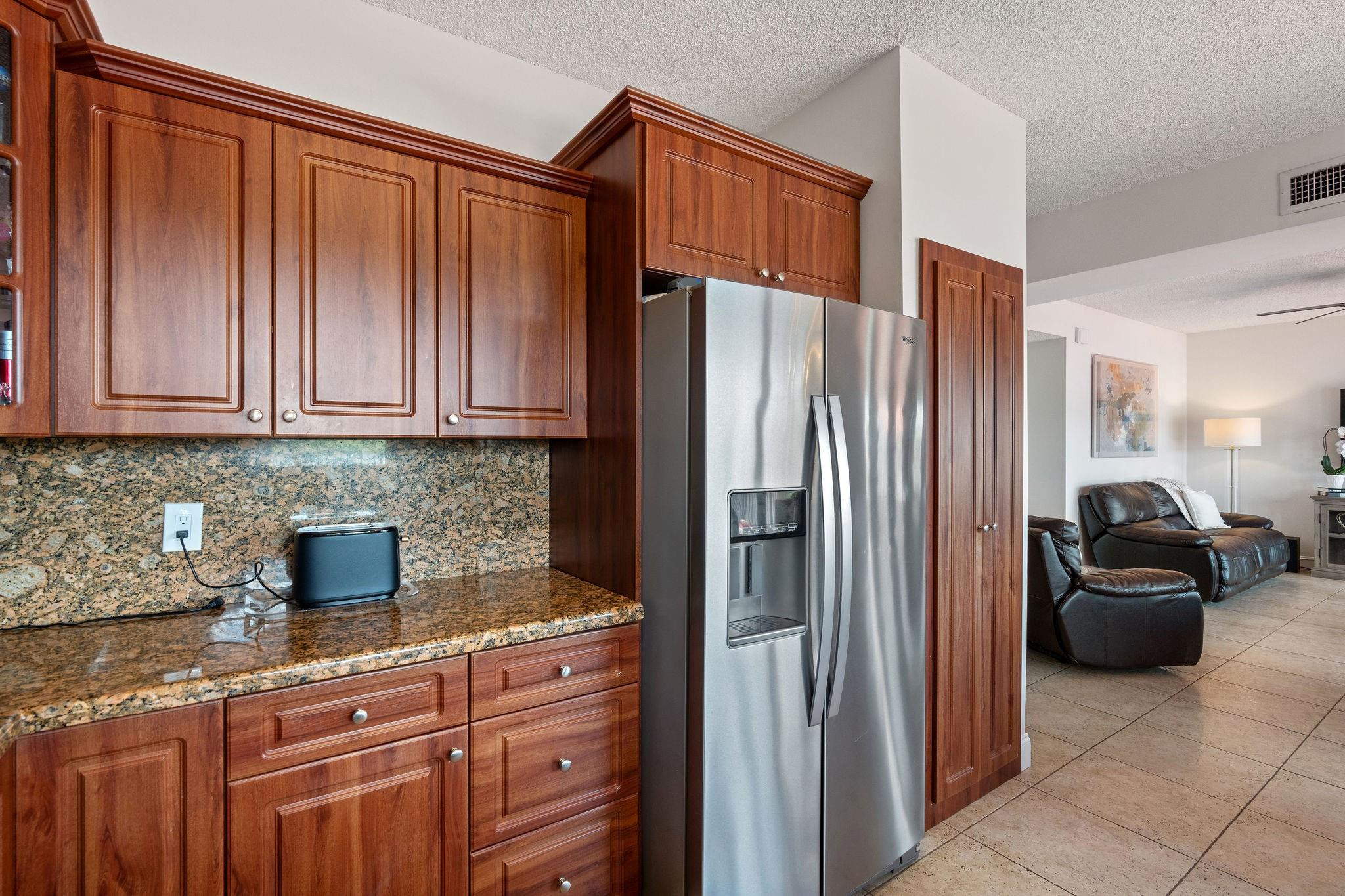 8313 Northwest 188th Terrace Hialeah, FL 33015 - Photo 30 of 50 a kitchen with stainless steel appliances granite countertop a refrigerator and a sink