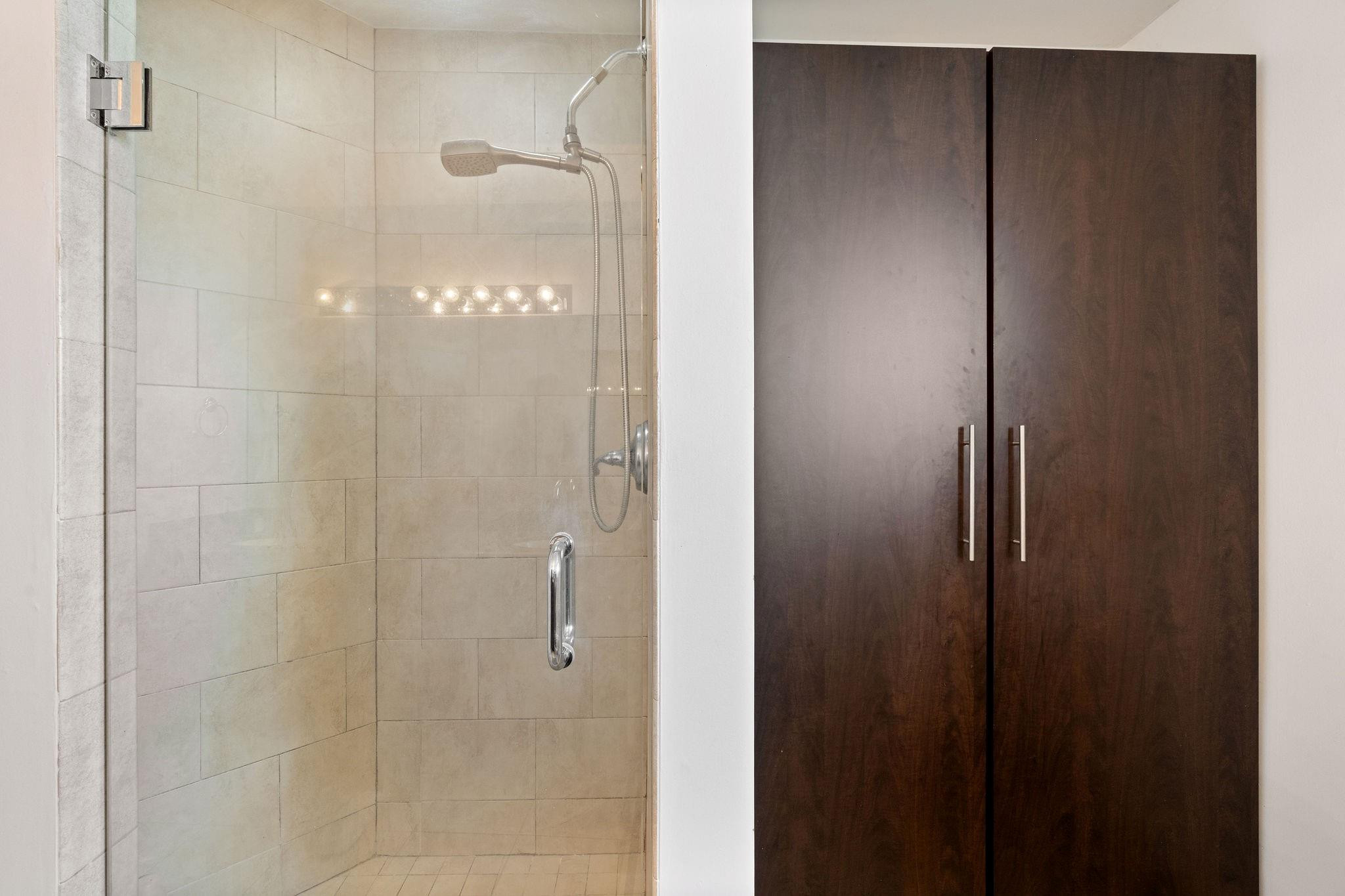 8313 Northwest 188th Terrace Hialeah, FL 33015 - Photo 42 of 50 a bathroom with a glass shower door