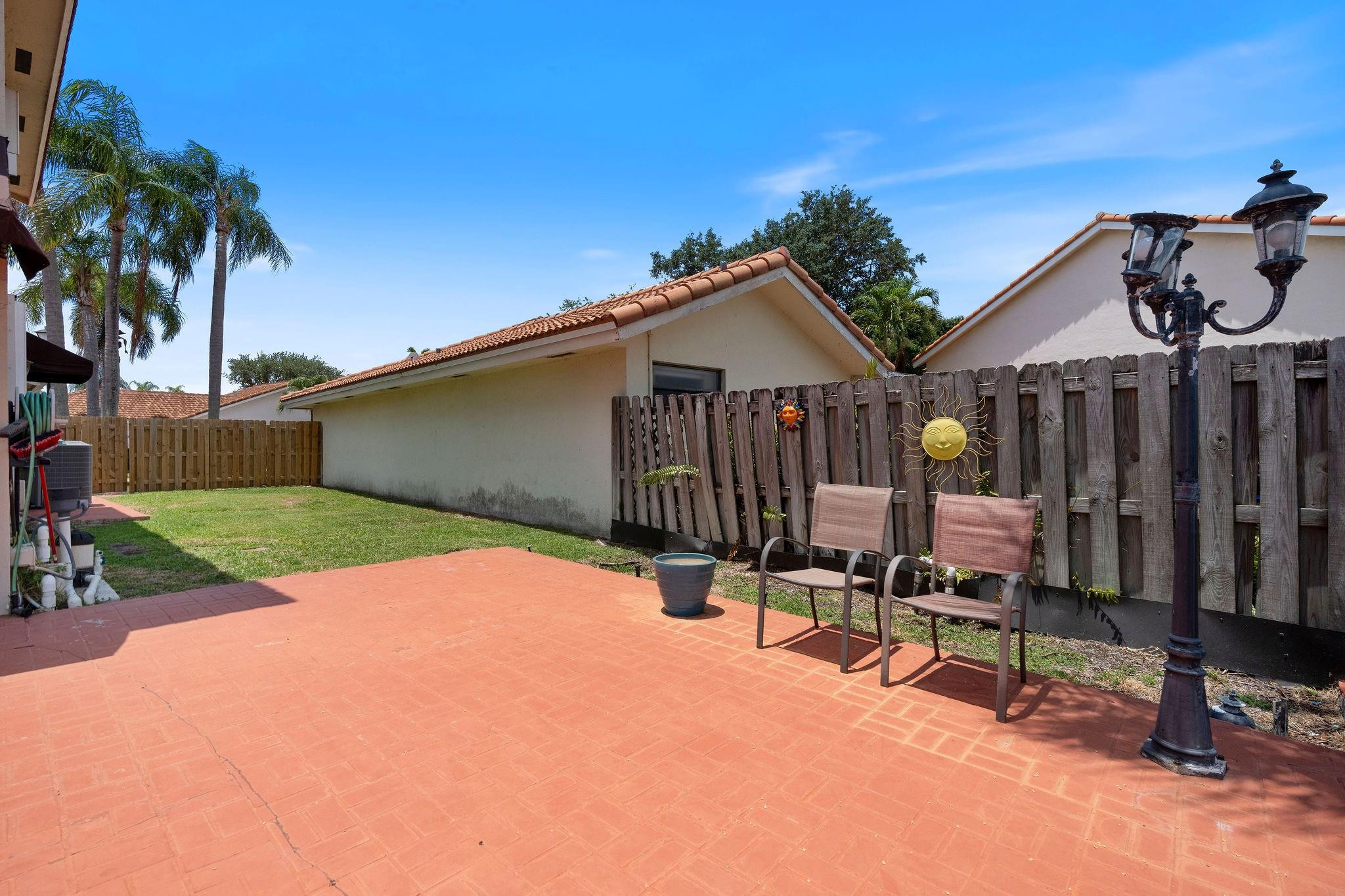 8313 Northwest 188th Terrace Hialeah, FL 33015 - Photo 49 of 50 a view of a house with backyard porch and sitting area