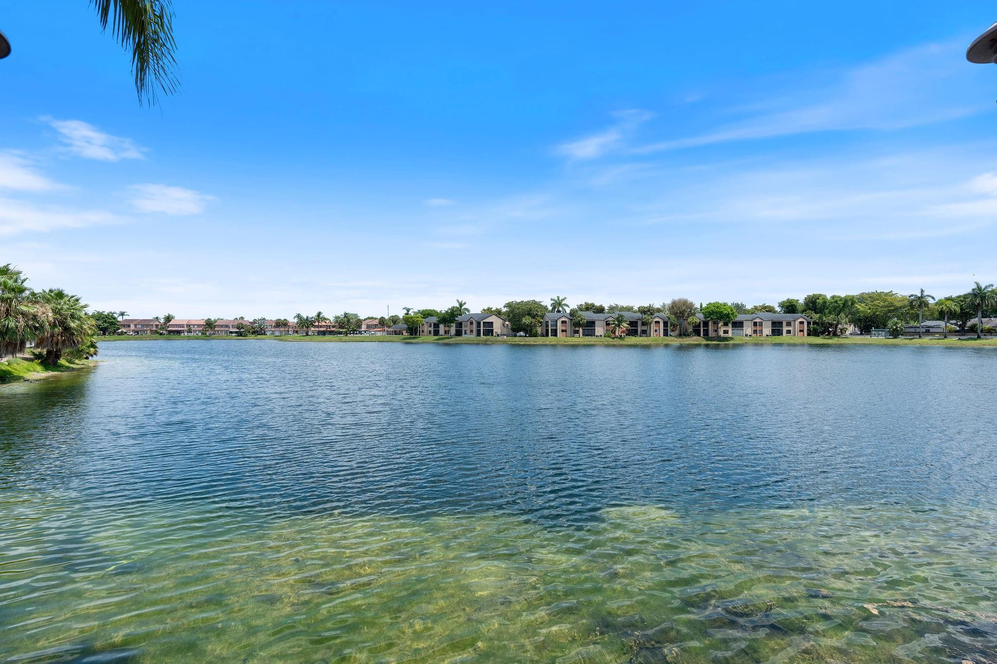 8313 Northwest 188th Terrace Hialeah, FL 33015 - Photo 50 of 50 a view of a lake with houses in the back