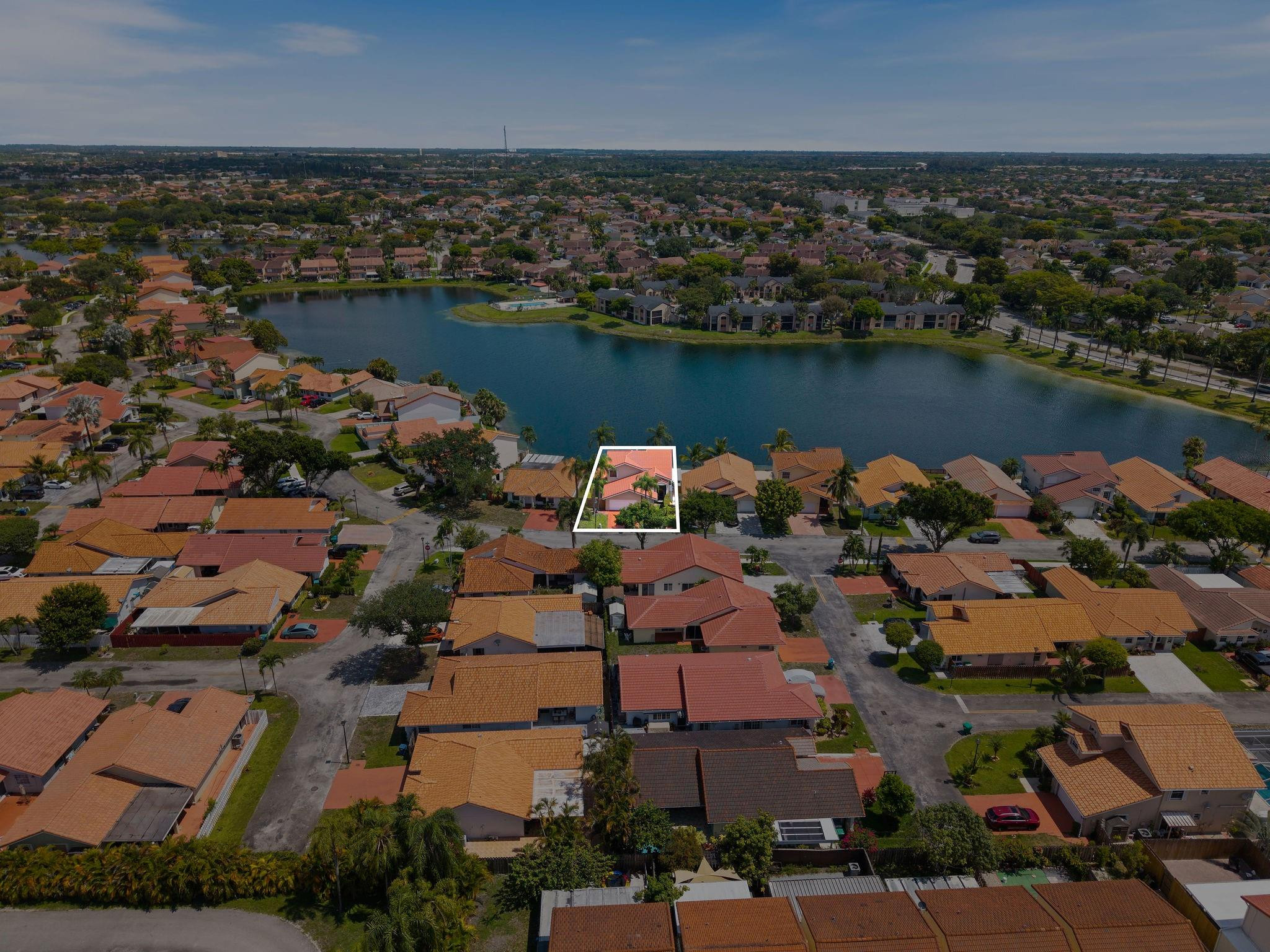 8313 Northwest 188th Terrace Hialeah, FL 33015 - Photo 9 of 50 an aerial view of house with yard and ocean view in back