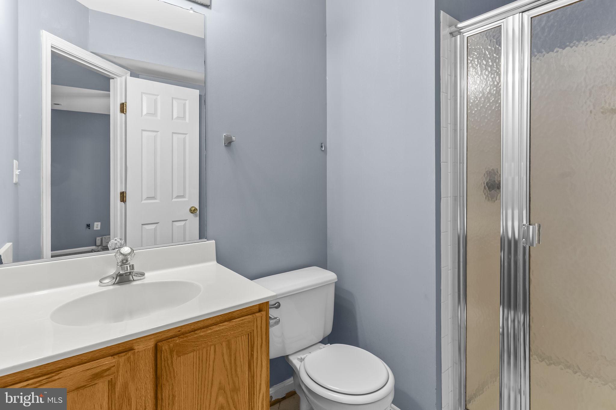 13192 Ripon Place Upper Marlboro, MD 20772 - Photo 18 of 23 a bathroom with a sink a toilet and shower