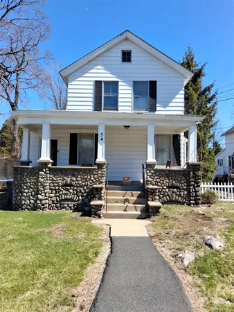 front view of a house with a yard