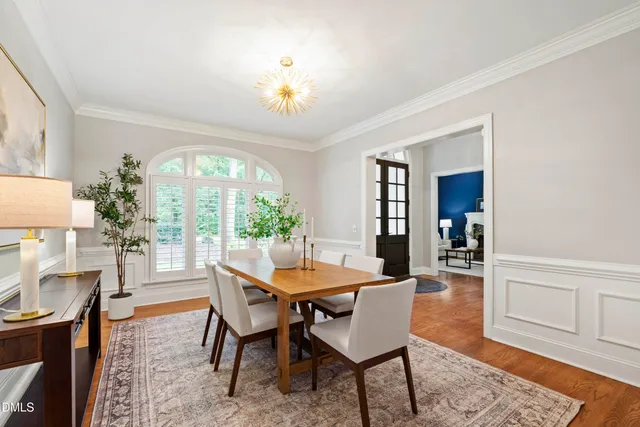 a kitchen that has a stove a sink and a refrigerator