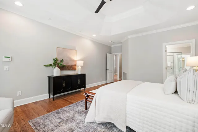 an empty room with a ceiling fan and a window