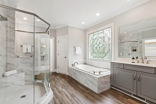 an empty room with chandelier fan and windows