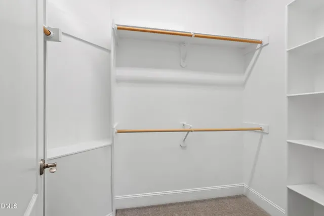 a view of closet area with empty racks