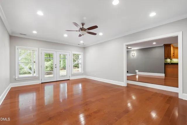 a view of backyard with deck and wooden floor