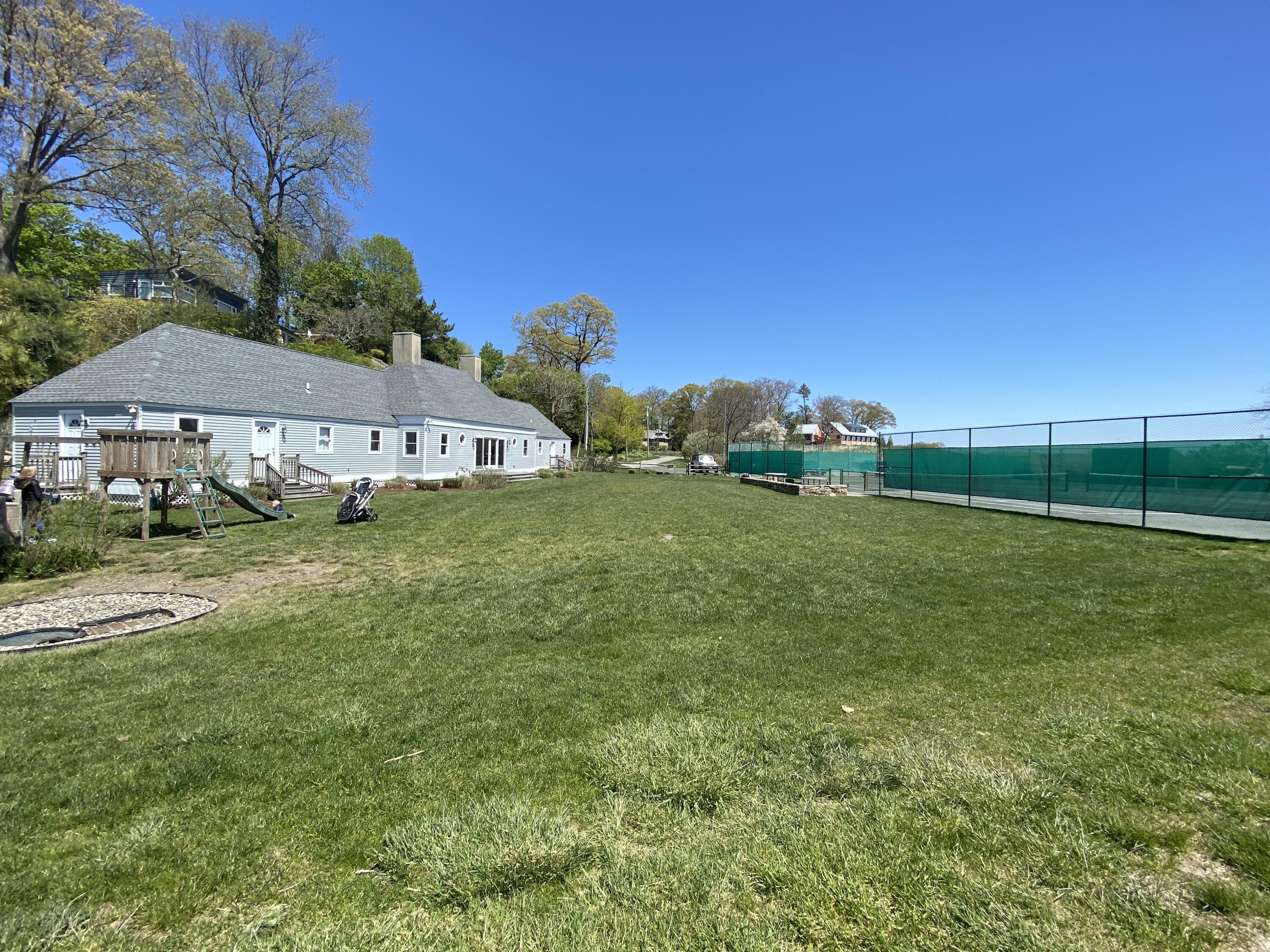 3 Hilltop Road, Unit 1 Norwalk, CT 06854 - Photo 9 of 11 a view of a field of grass and trees
