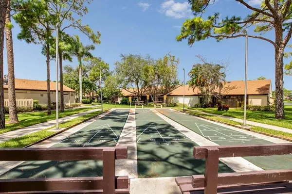 a view of a yard with cars