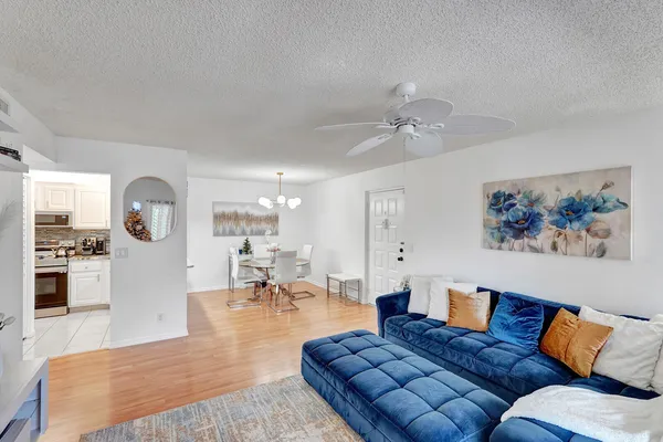 a living room with furniture rug and window