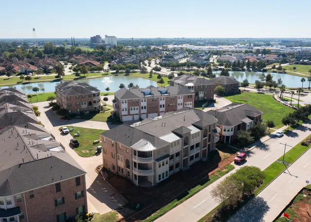 an aerial view of a city with lots of residential buildings