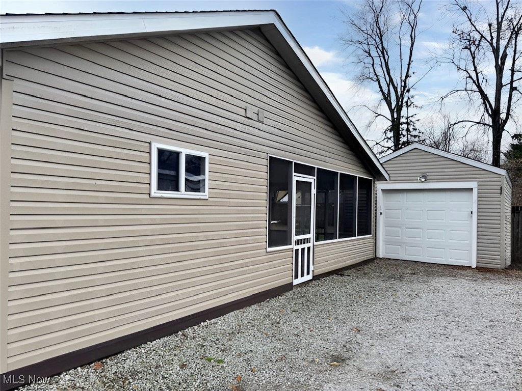 4842 Marigold Road Mentor, OH 44060 - Photo 4 of 13 View of property exterior featuring a garage and an outdoor structure