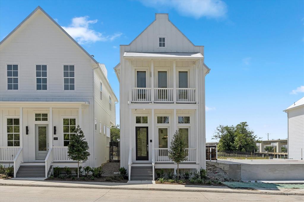 1362 East Crosby Road Carrollton, TX 75006 - Photo 16 of 22 Modern farmhouse-style exterior featuring white vertical siding and a prominent front-facing gable roof