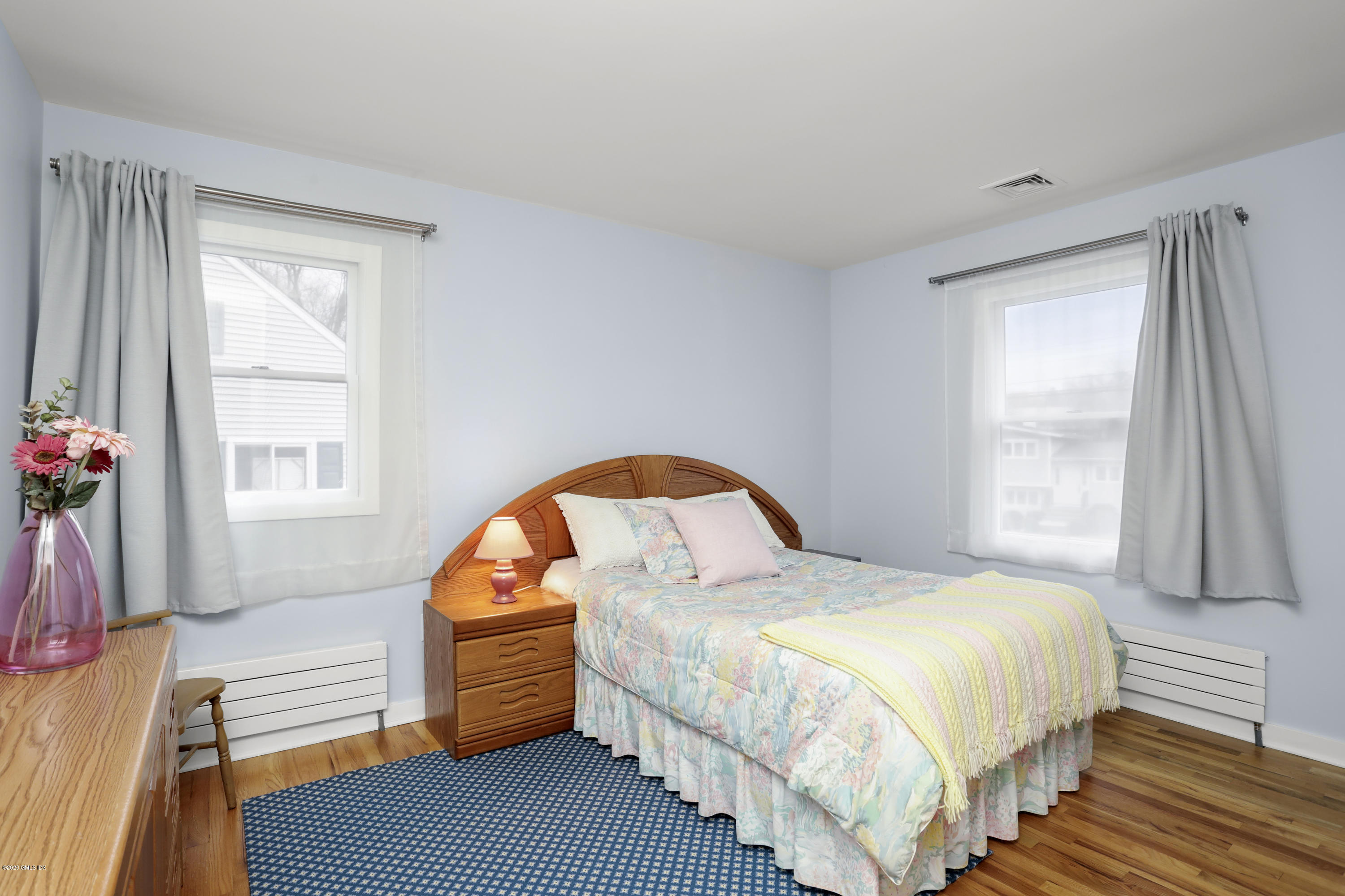 41 Mary Lane Riverside, CT 06878 - Photo 14 of 34 a bedroom with a bed and a window